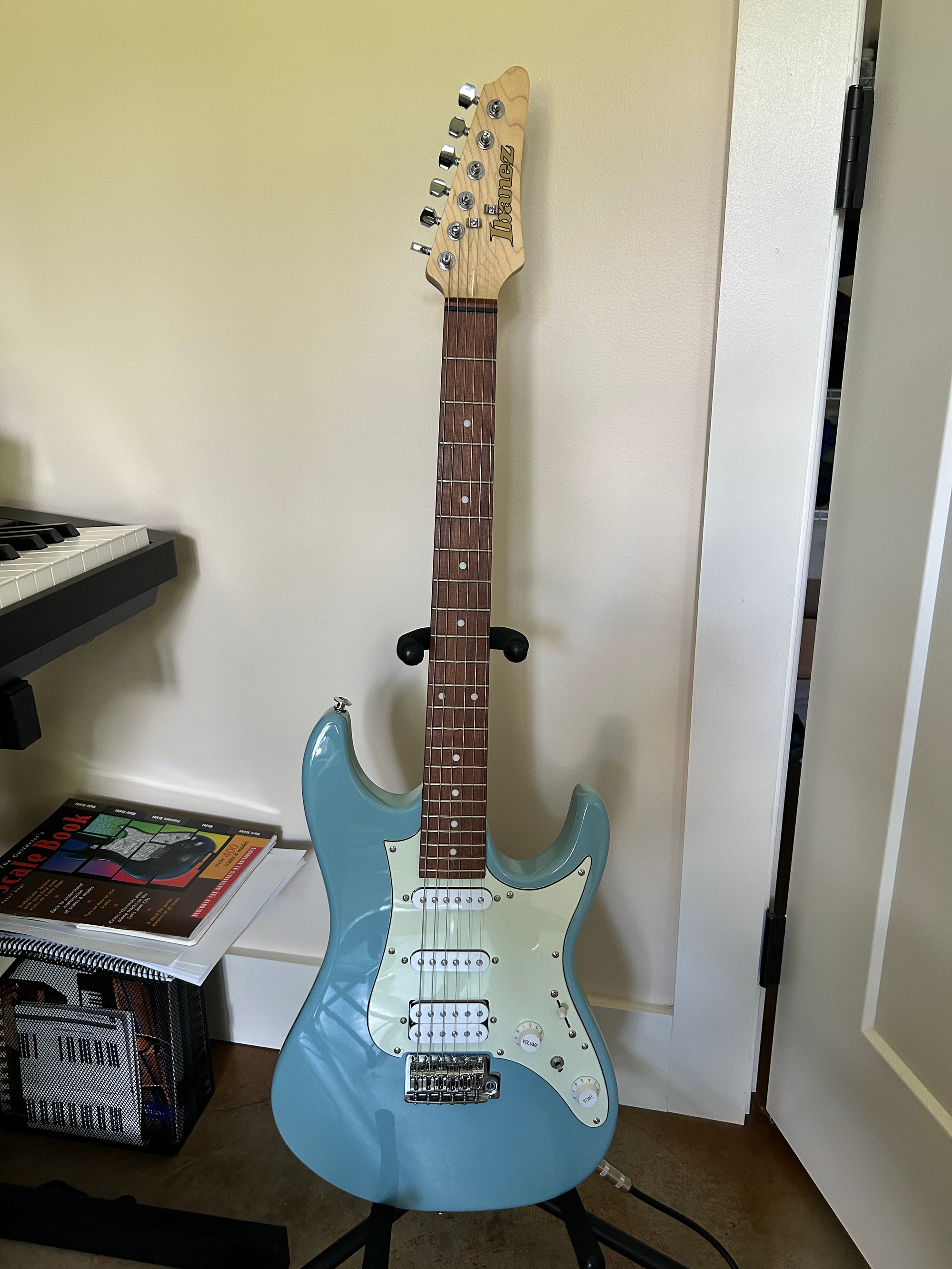 Ibanez electric guitar on floor stand